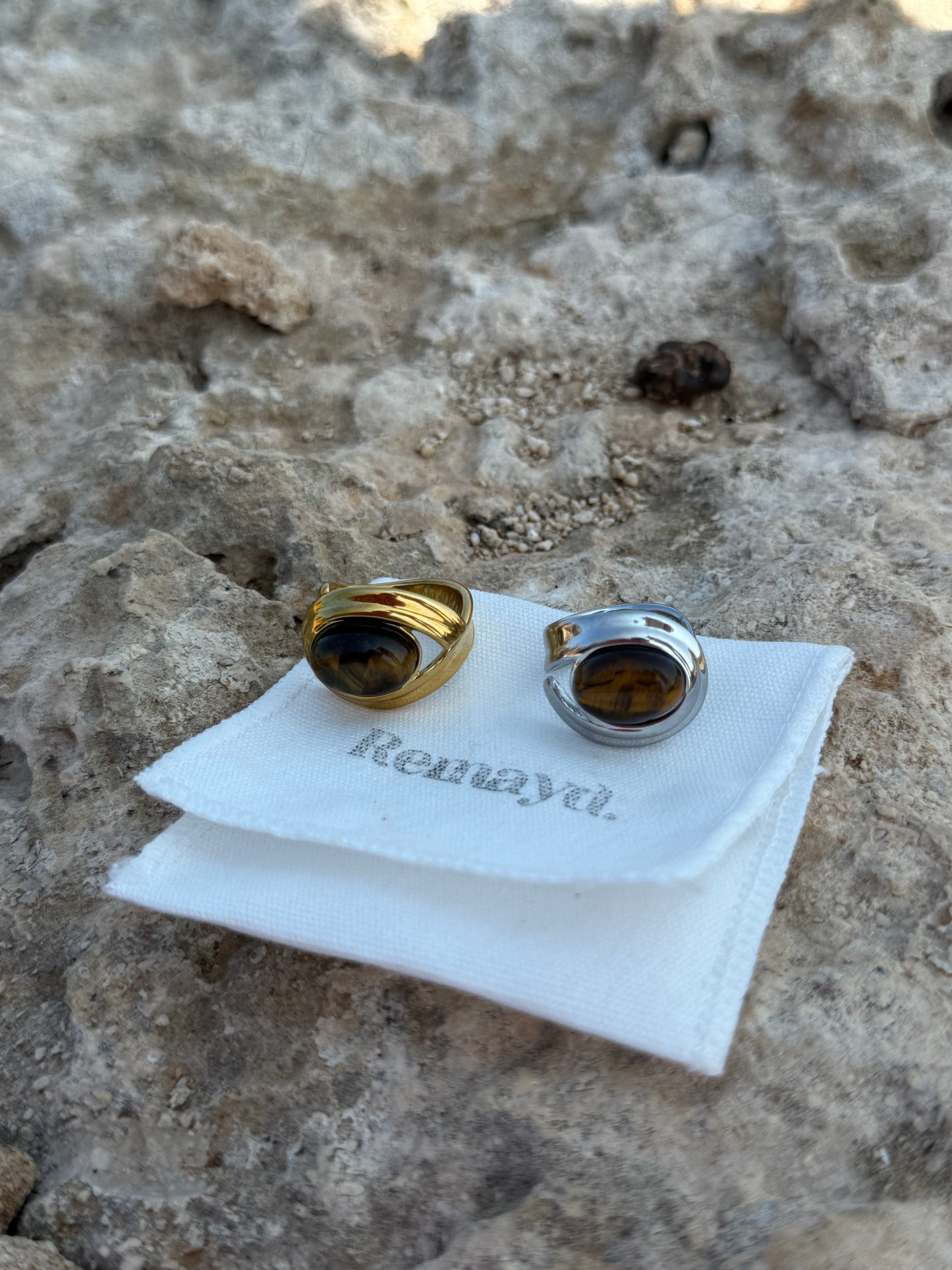 Two BROWN GEMSTONE RINGS
