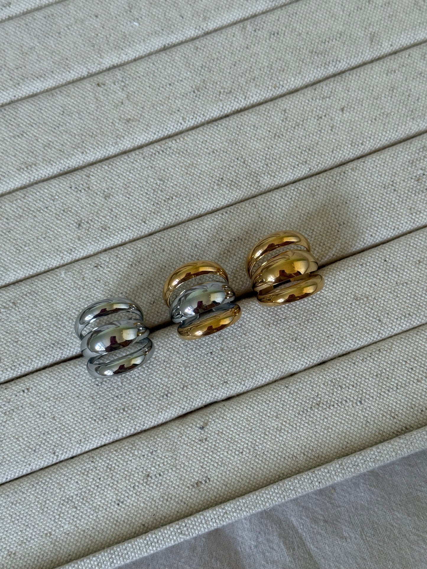 THREE CHUNKY RINGS, GOLD, SILVER, MIXED METAL