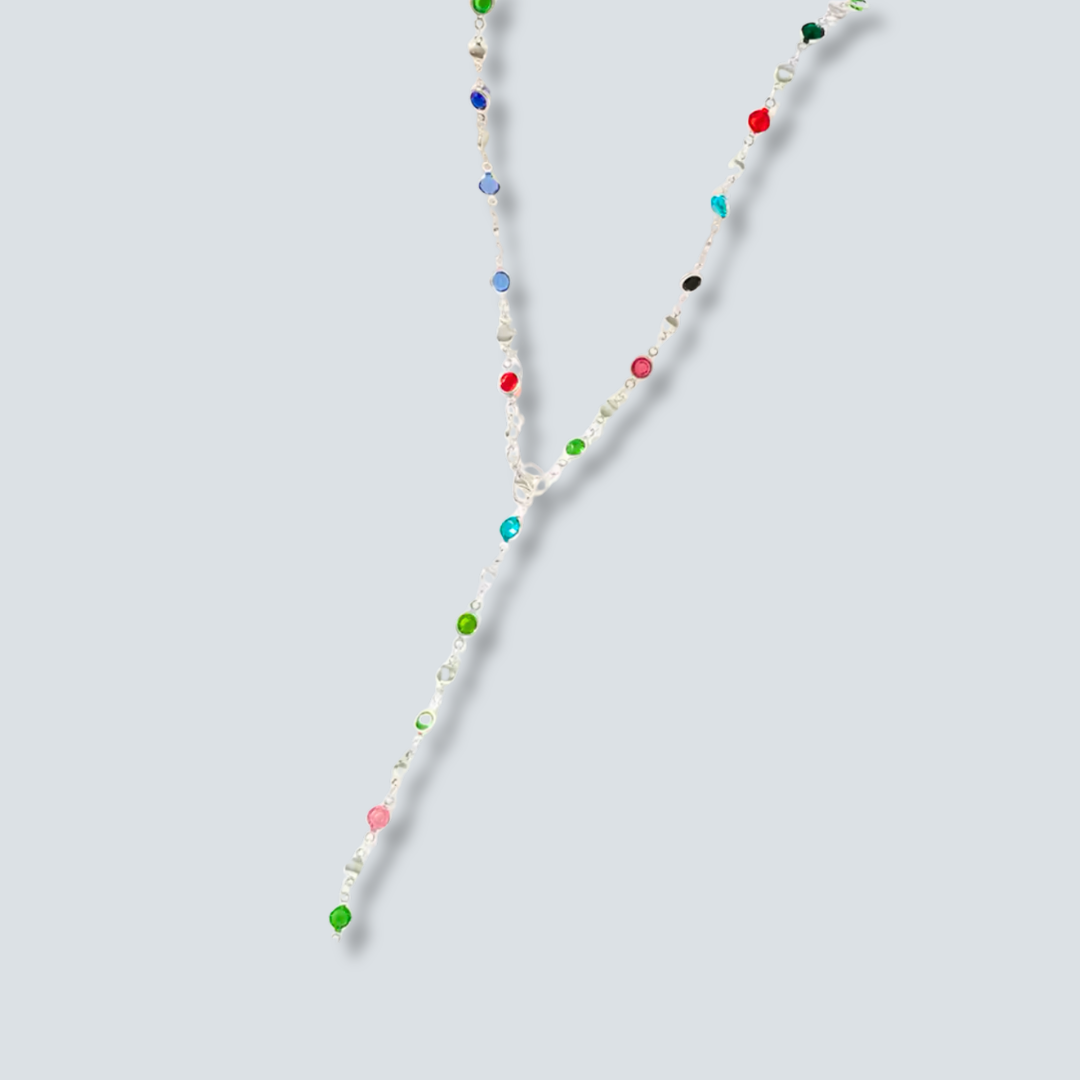 Necklace with multicolored beads on a light gray background