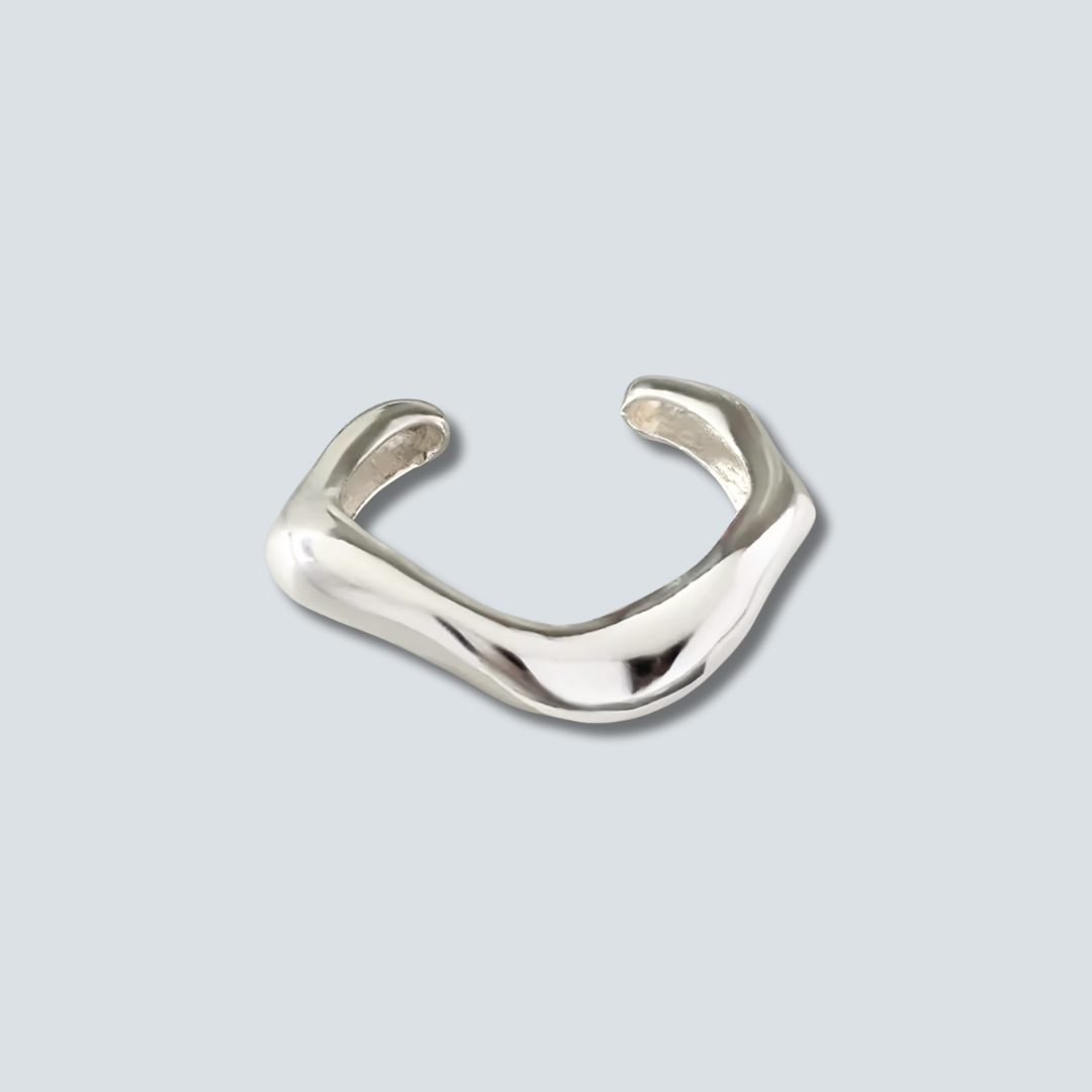 Silver ring on a light gray background