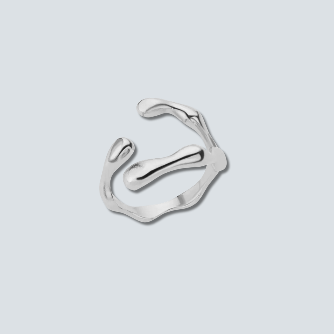 Silver ring with a modern design on a light gray background