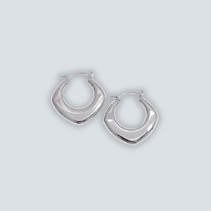 Pair of silver hoop earrings on a light gray background
