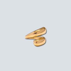Gold ring on a light gray background