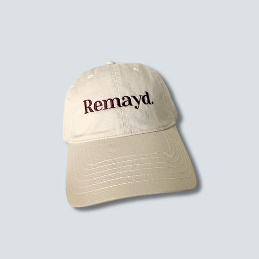 Beige cap with 'Remayd.' text on a light gray background