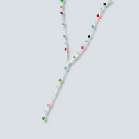 Necklace with multicolored beads on a light gray background