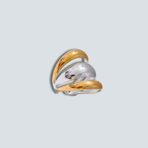 Two-tone gold and silver ring on a light gray background